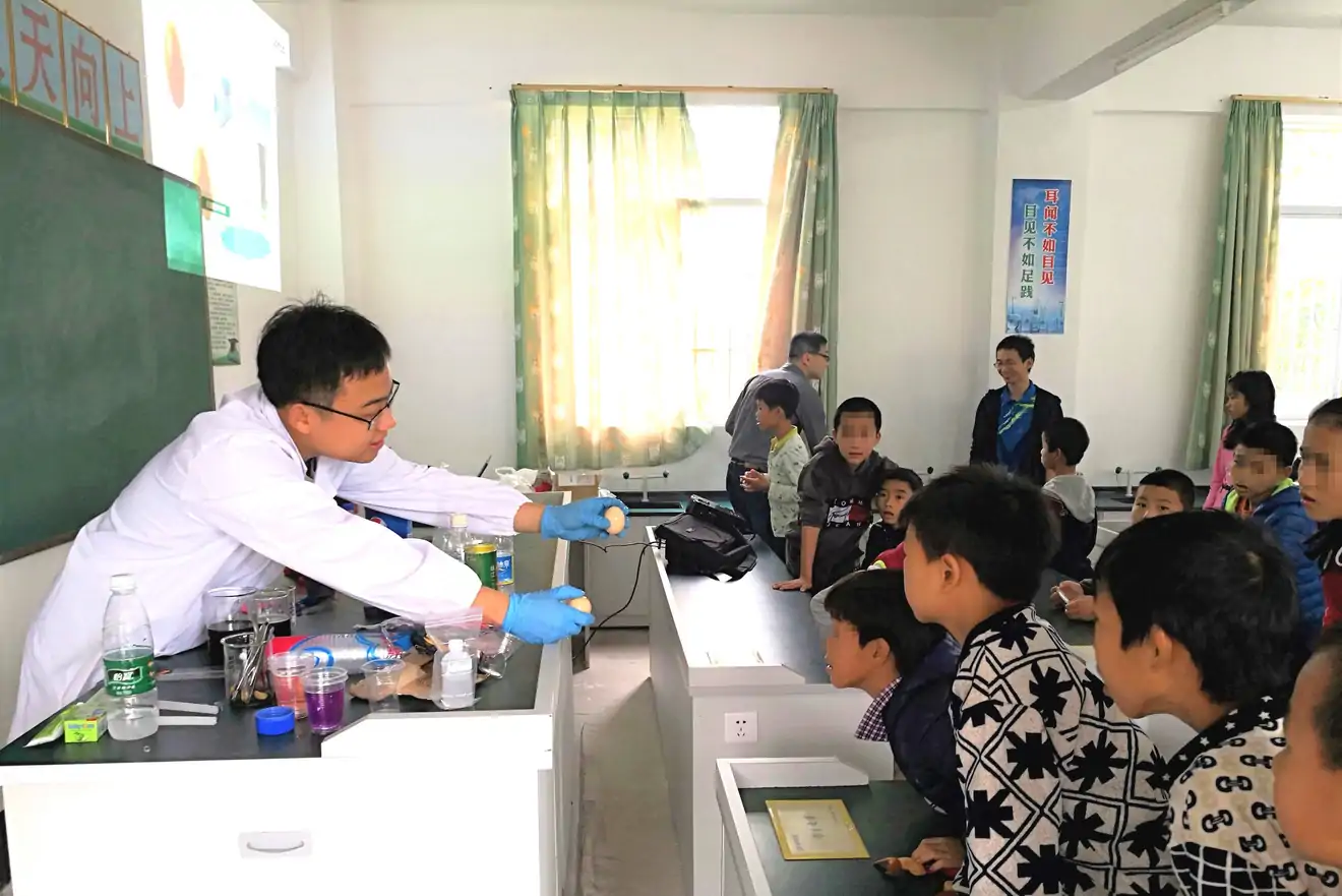 teacher displaying eggs to students